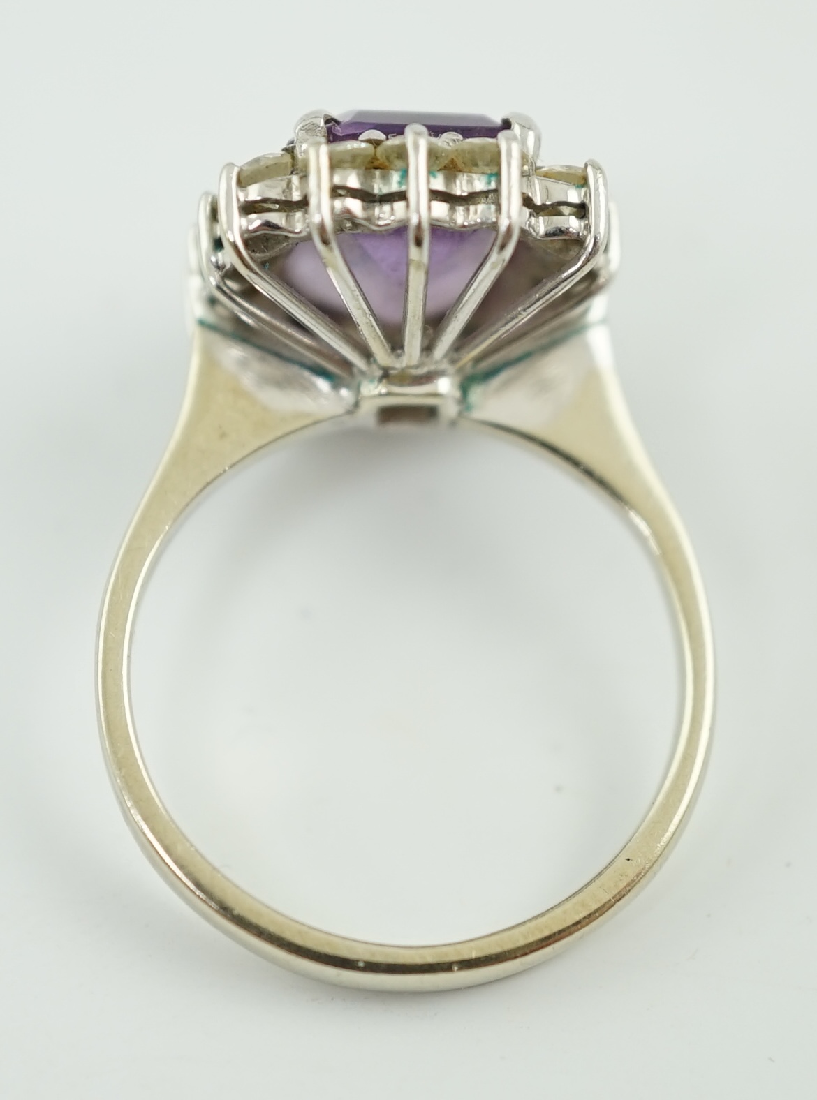 A modern white gold, amethyst and diamond set rectangular cluster ring